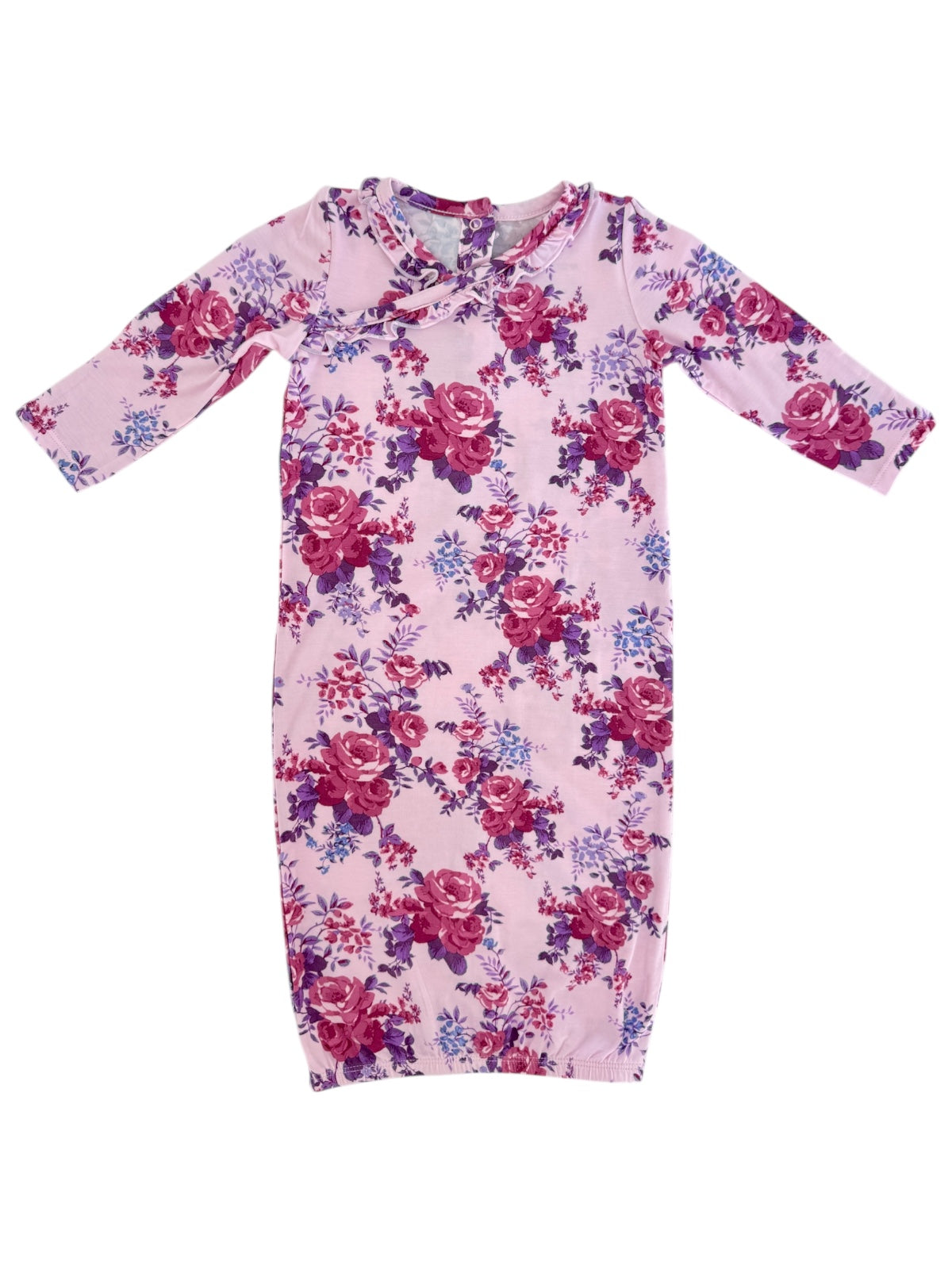 Pink floral baby dress featuring long sleeves and a round neckline with floral patterns in shades of purple and red.