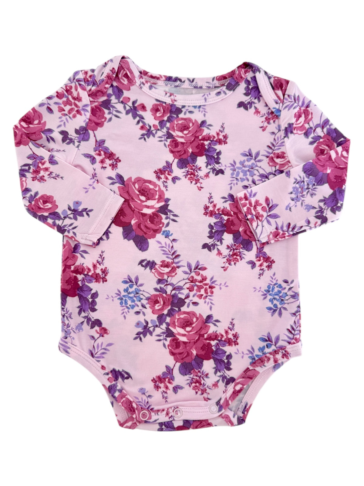 Floral long-sleeve onesie in pink and purple shades with snaps at the bottom for easy dressing.