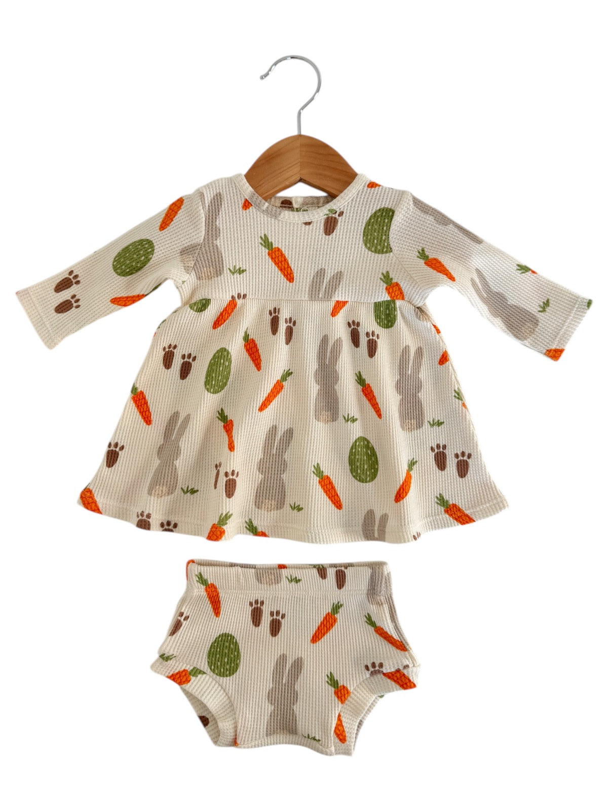 Child's dress and matching bloomers featuring a playful bunny and carrot print on a light background.