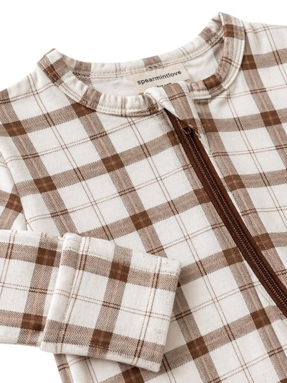 Brown plaid zip-up baby outfit featuring soft fabric and ribbed cuff details.