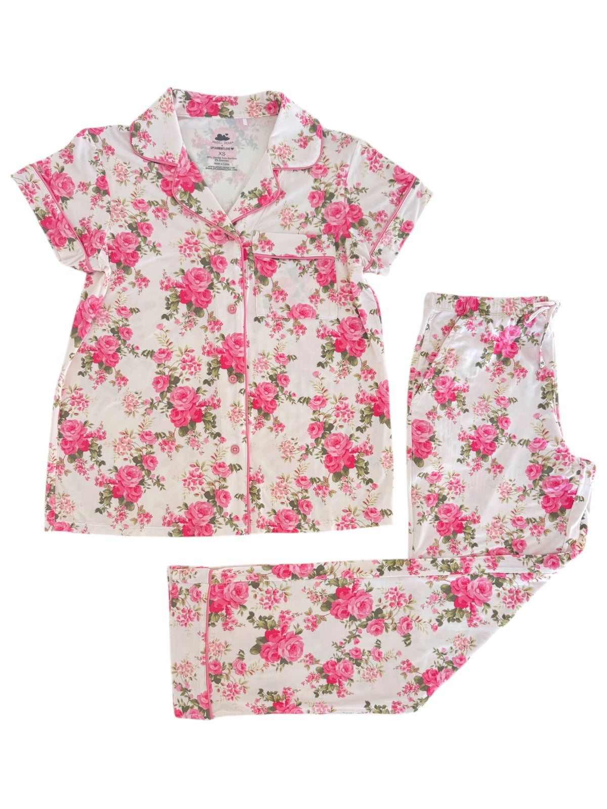 Floral pajama set featuring a button-up top and matching pants with pink roses on a white background.