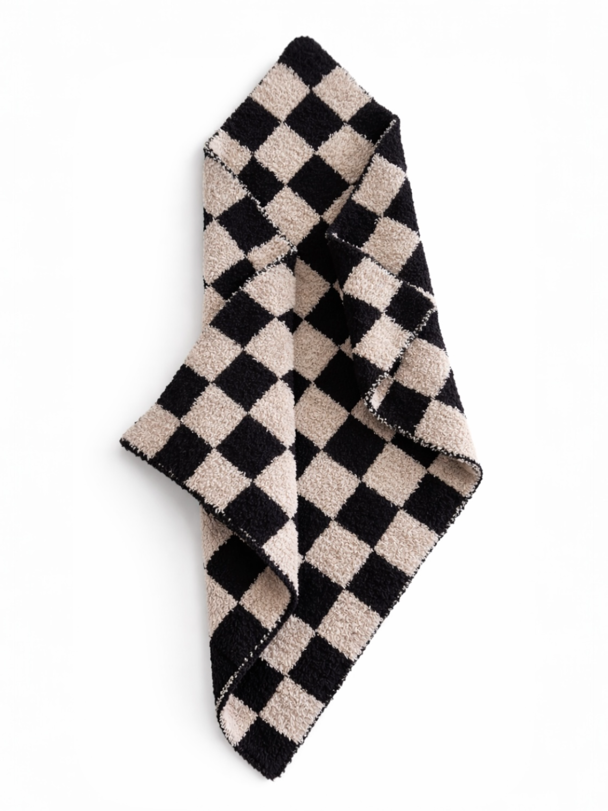 Black and beige checkered towel folded diagonally on a white background.