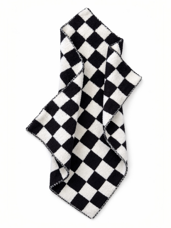 Black and white checkered towel draped elegantly on a light background.