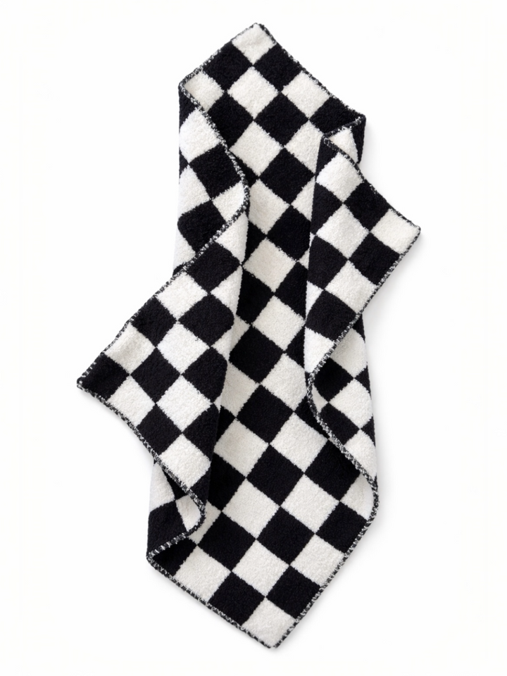 Black and white checkered towel draped elegantly on a light background.