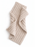 Beige ribbed scarf laid flat, showcasing its soft texture and folded design against a white background.