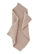 Beige textured blanket folded on a white background, showcasing its soft, cozy design.