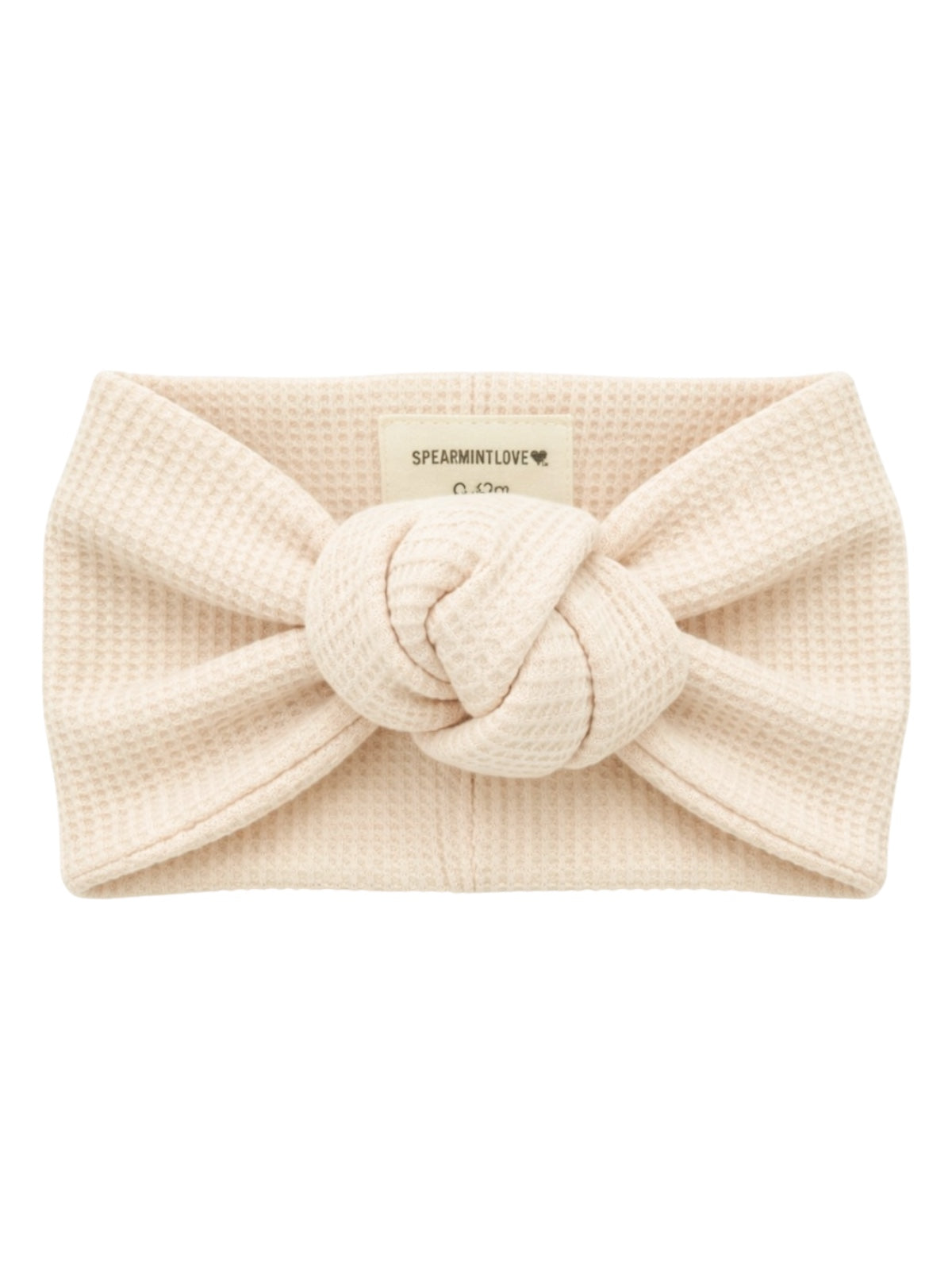Cream-colored knotted headband made of textured fabric, labeled 'SPEARMINTLOVE.'