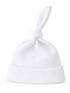 White baby hat with a knot at the top and a folded brim, made from textured fabric.