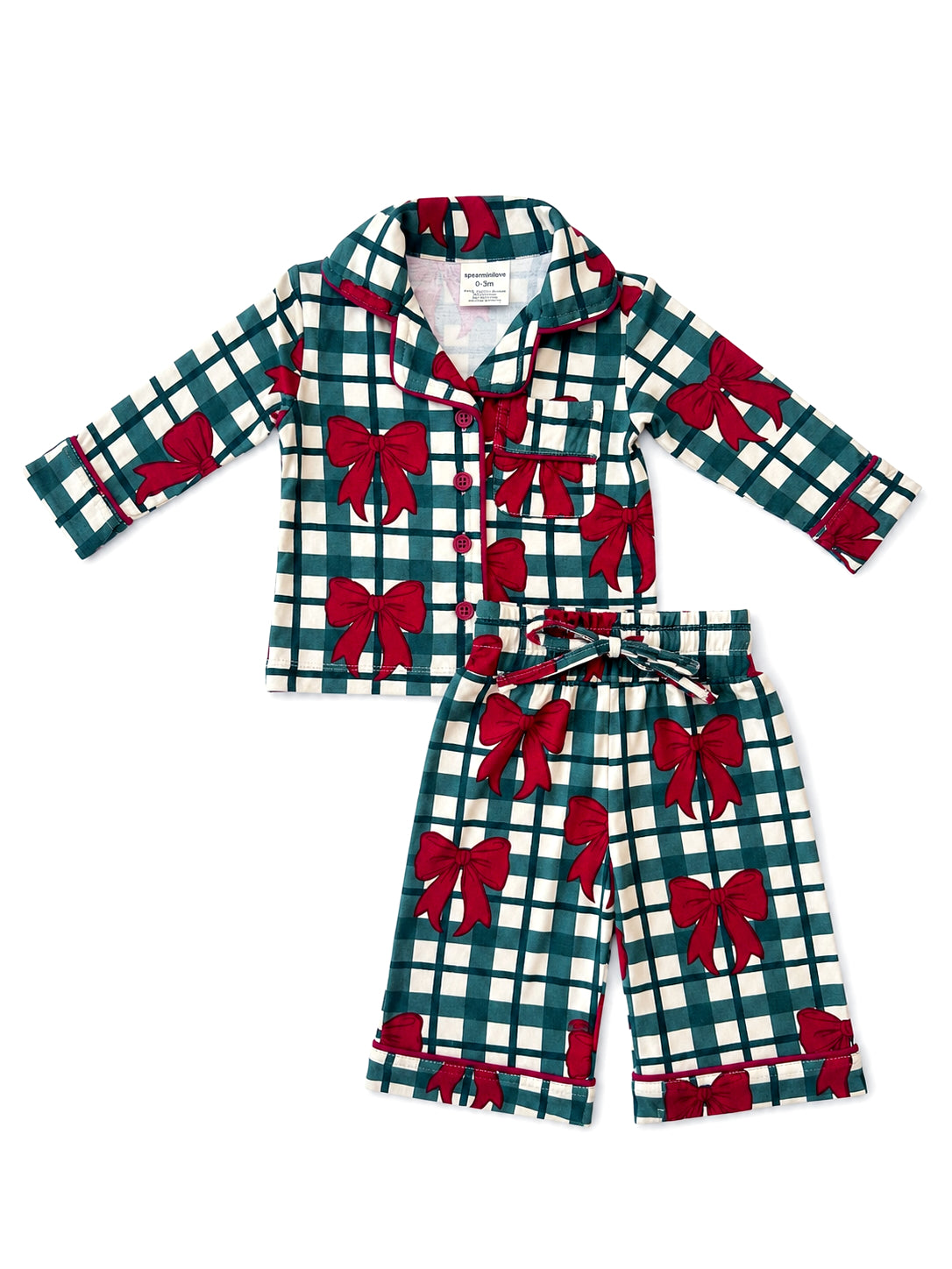 Green plaid pajamas with red bows, featuring a button-up top and matching pants.  Suitable for infants and toddlers.