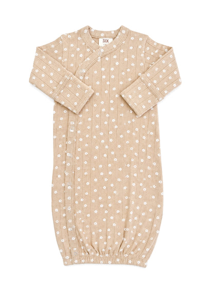 Beige infant sleeping gown with white floral pattern and ribbed texture, featuring snap closures and gathered hem.