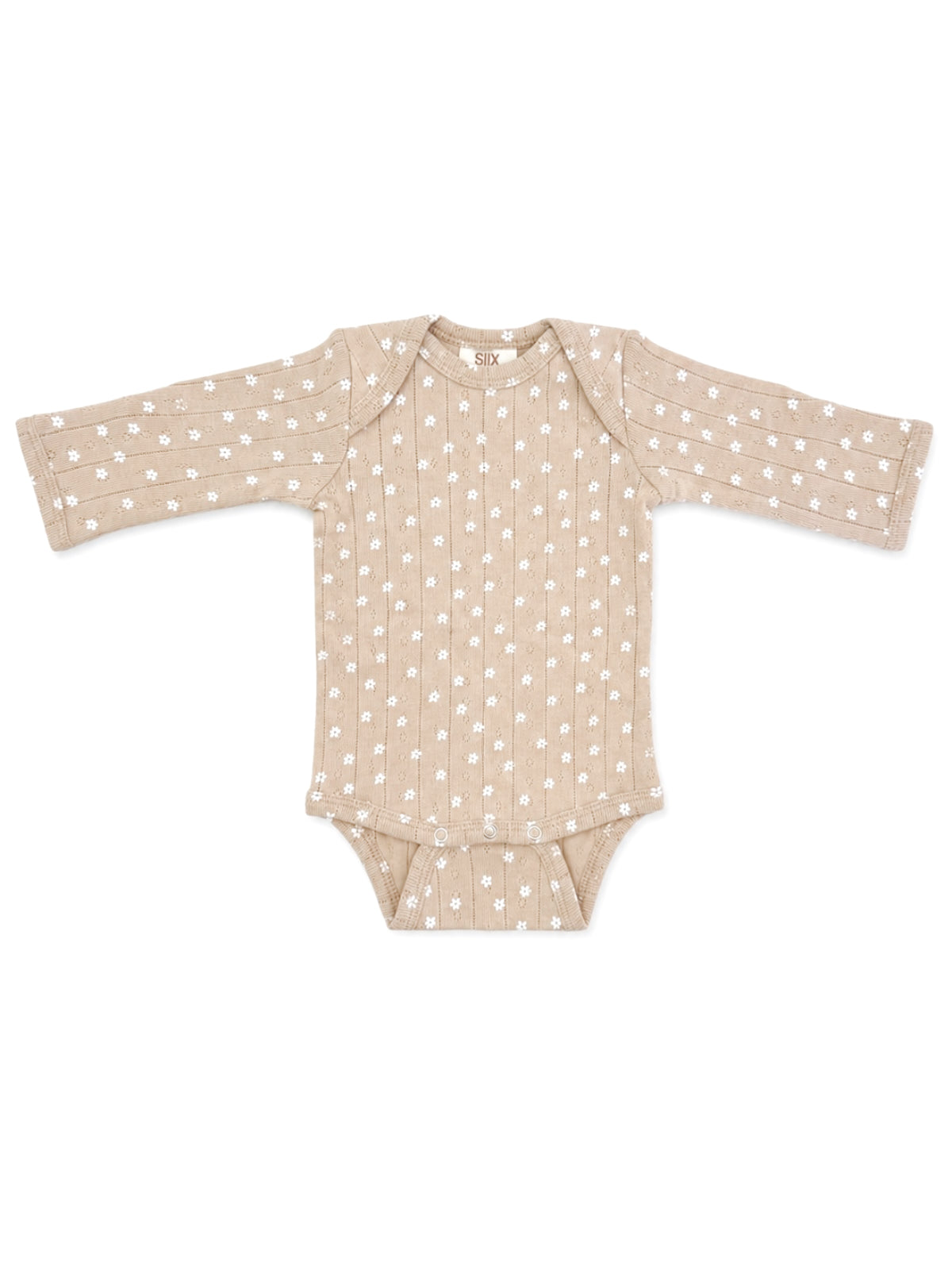 Beige baby bodysuit with long sleeves and white flower pattern, featuring snap closures at the bottom.