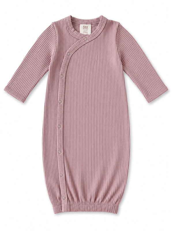 Light pink ribbed baby gown with long sleeves and snap closure, ideal for infants 0-3 months.