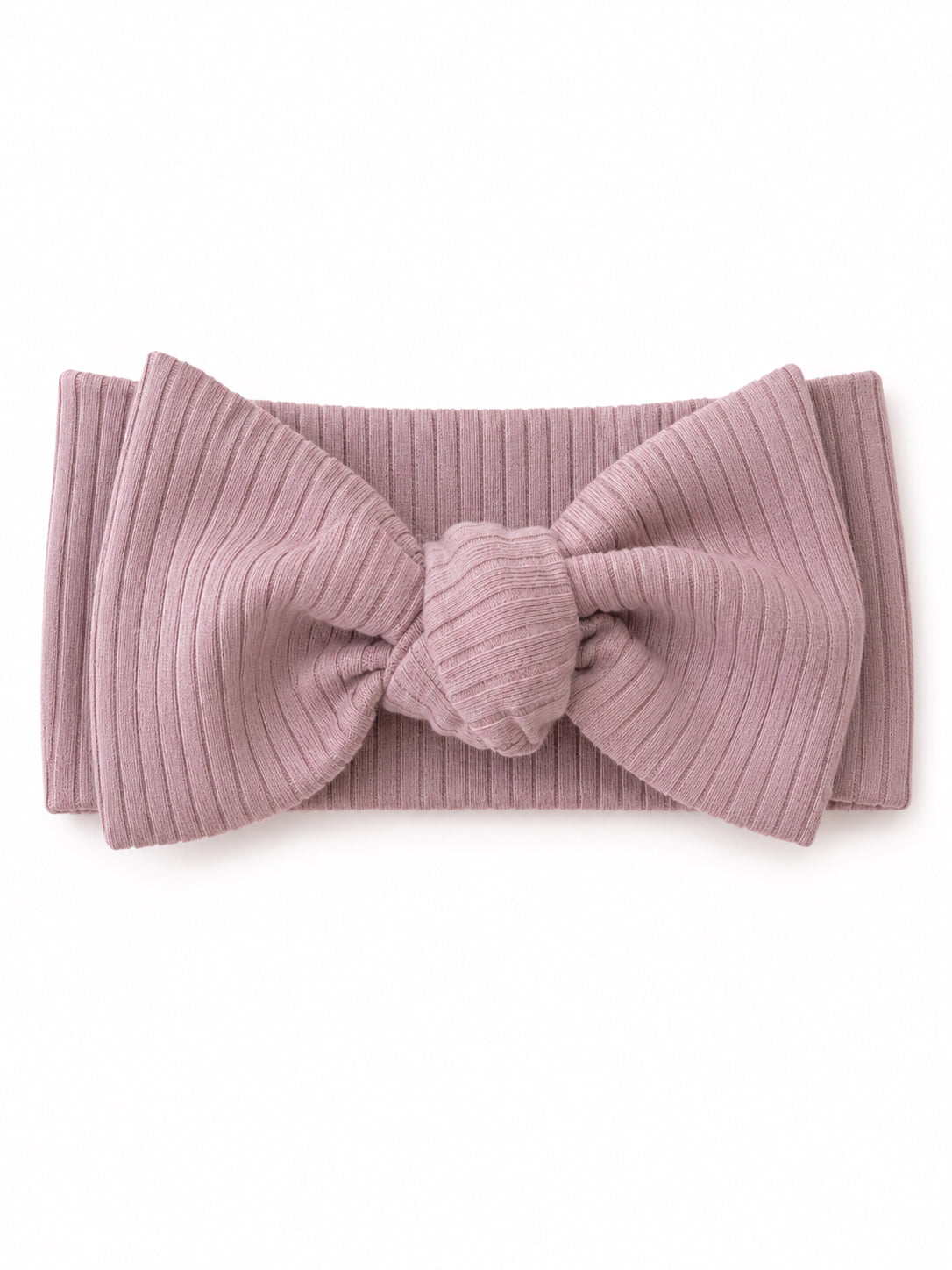 Light pink ribbed headband with a large bow detail, displayed on a white background.