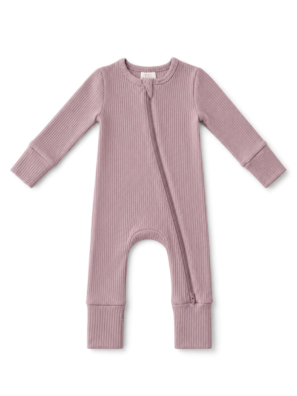 Light mauve baby onesie with long sleeves and a front zipper, featuring ribbed texture.