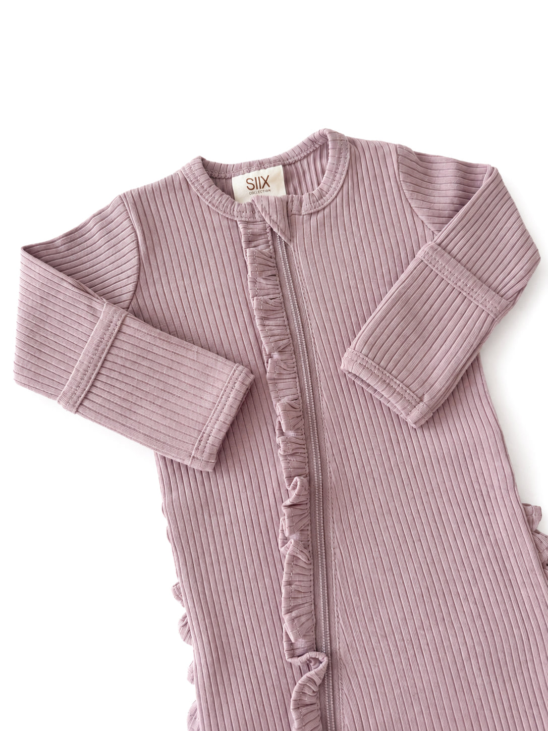 Light purple ribbed infant sleep sack with a front zipper and ruffle details along the opening and sides.