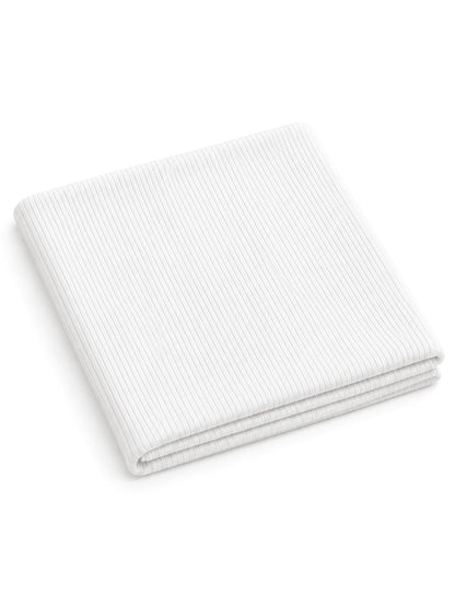 White ribbed blanket folded neatly. Ideal for cozying up or adding texture to home decor.