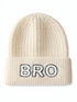 Cream-colored knit beanie with "BRO" embroidered in black on the front.