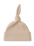 Beige ribbed knit hat with a knotted top and a folded brim, ideal for casual wear.