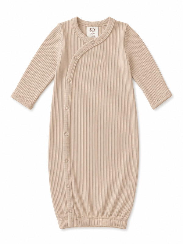 Beige ribbed baby gown with long sleeves and snap buttons, designed for newborns up to 3 months.
