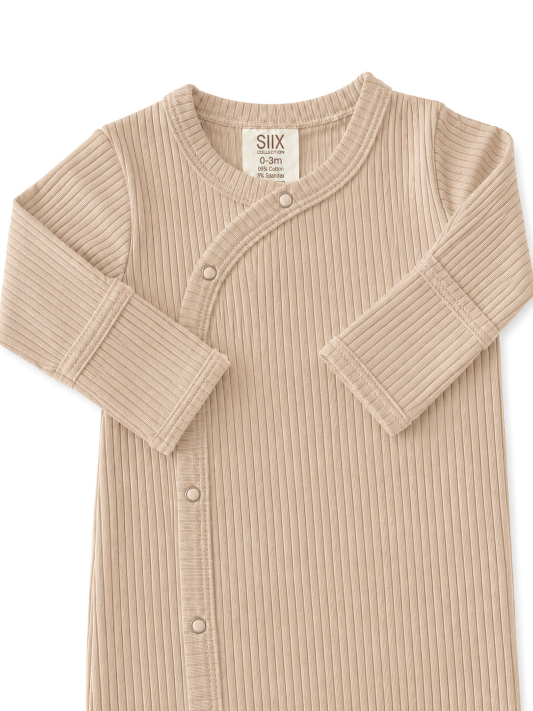 Tan ribbed baby bodysuit with button closure and soft fabric, labeled for size 0-3 months.
