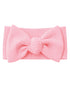 Pink ribbed headband with a large bow centerpiece, perfect for accessorizing outfits.
