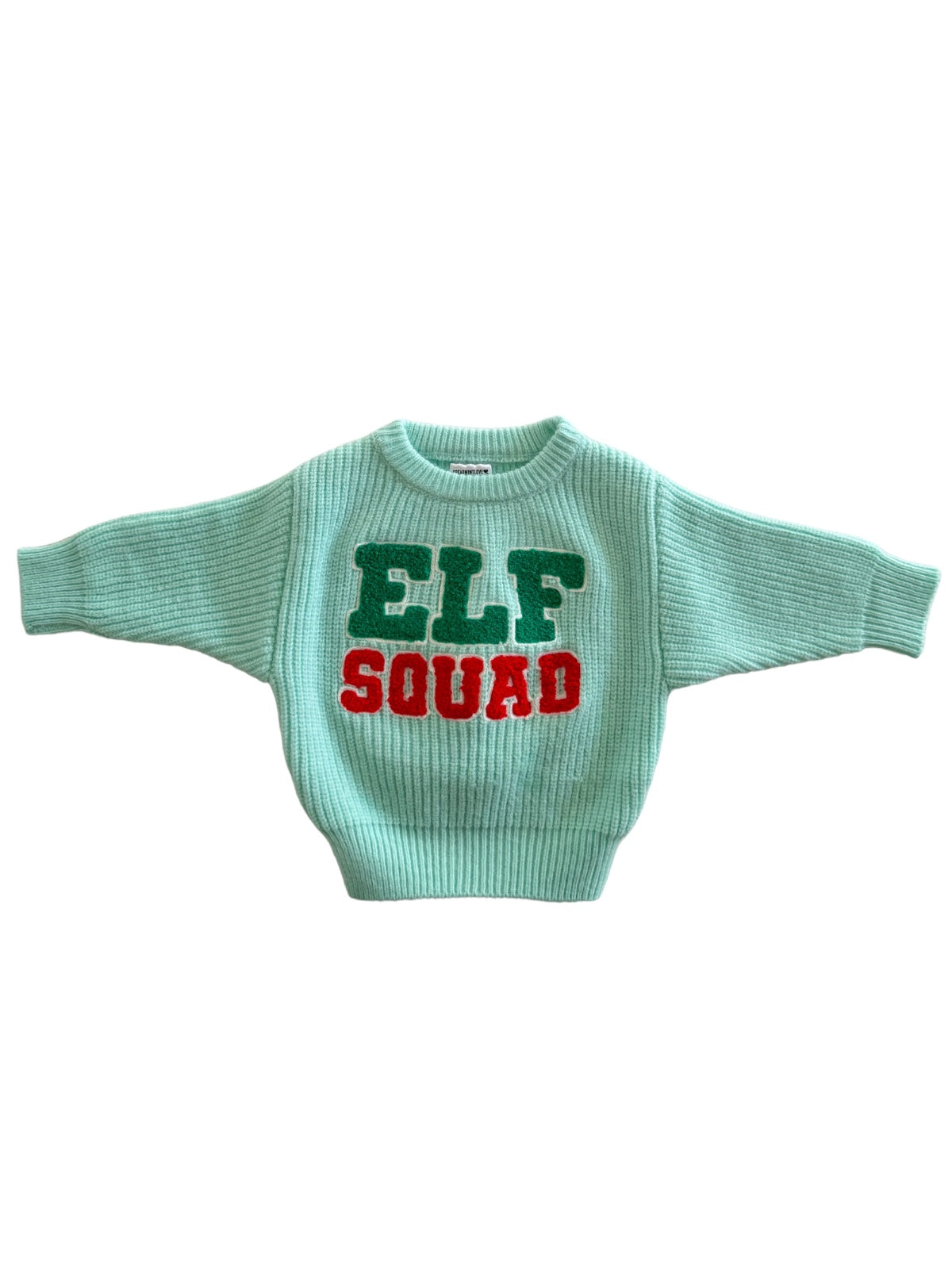 Light green knit sweater featuring "ELF SQUAD" text in green and red letters. Perfect for holiday celebrations.