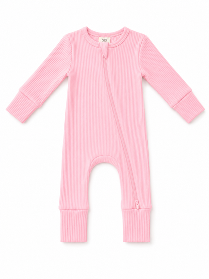 Pink ribbed infant onesie with long sleeves and a front zipper. Soft, cozy, perfect for play or sleep.
