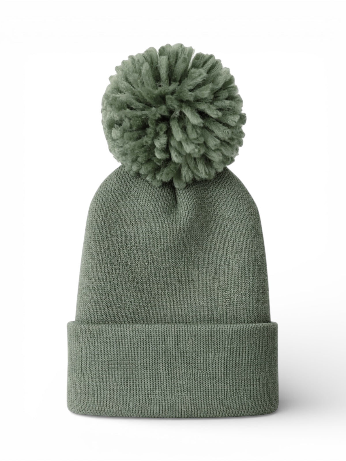Green knit beanie with a fluffy pom-pom on top, set against a white background.