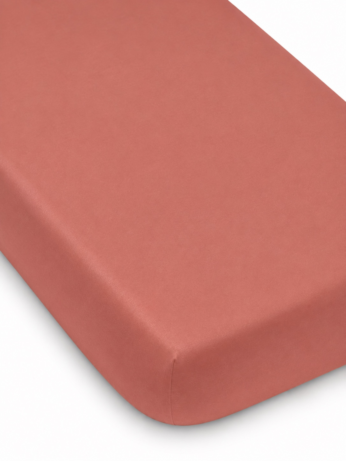 Coral rectangular mattress with a smooth surface and rounded edges. Ideal for a stylish bedding setup.
