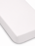 White mattress cover with small pink dots, featured at an angle to show the fitted edge.