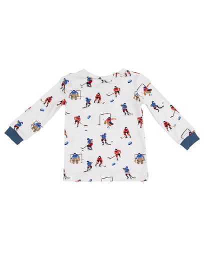 Long-sleeve children's shirt with hockey player print on a white background.