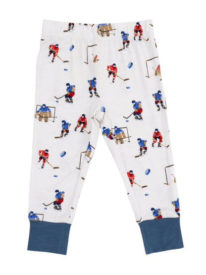 Kids' pajama pants with a colorful hockey print featuring players and equipment on a white background.