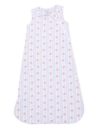 White sleeveless dress with pink floral patterns and blue stripes, designed for children.