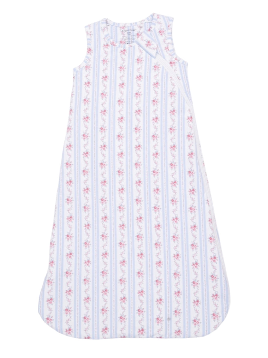 White sleeveless dress with pink floral patterns and blue stripes, designed for children.