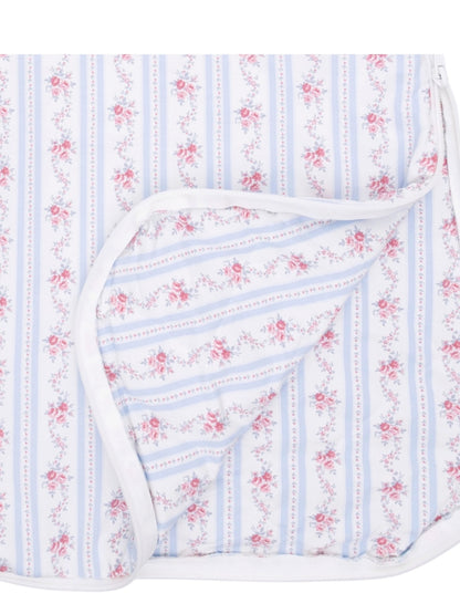 Floral patterned fabric in blue and white stripes, featuring pink roses and a white border design.