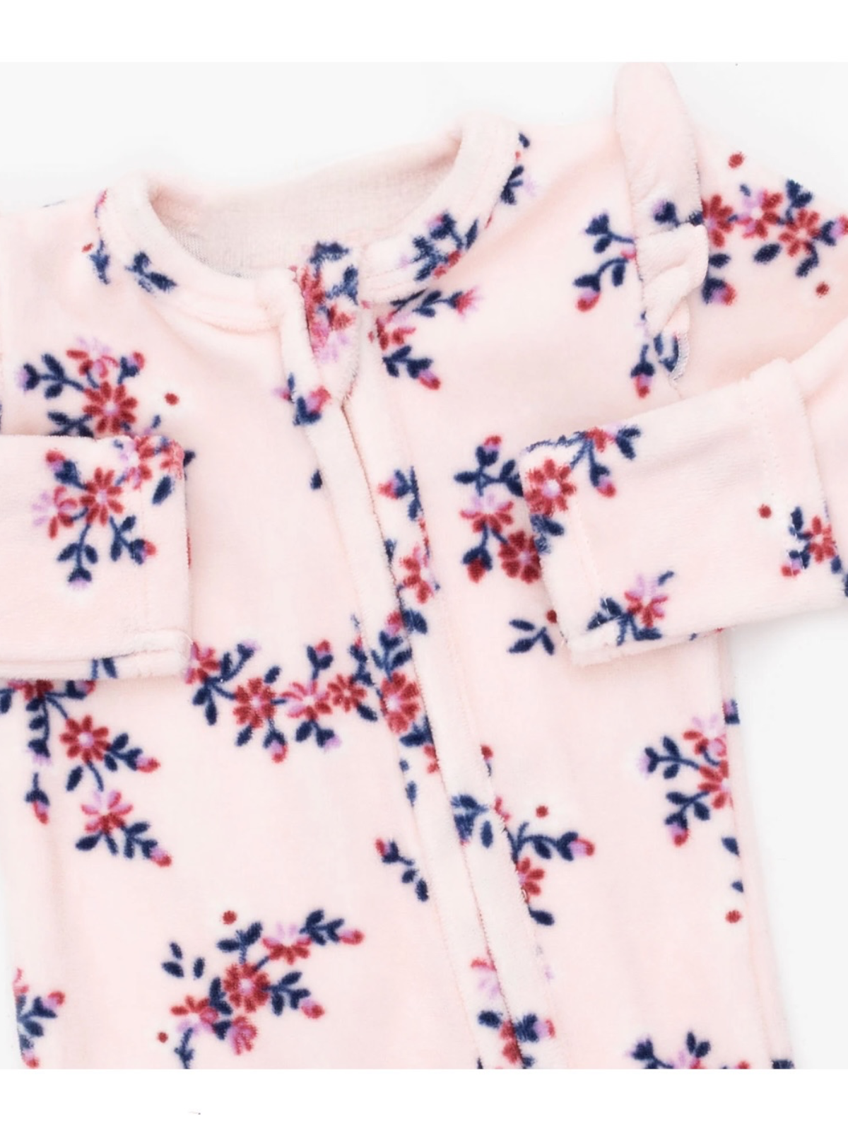 Pink floral onesie with navy and red flowers, featuring a zipper and long sleeves for warmth and comfort.