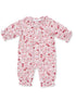 Floral print baby romper in soft pink and white, featuring gathered sleeves and leg openings.