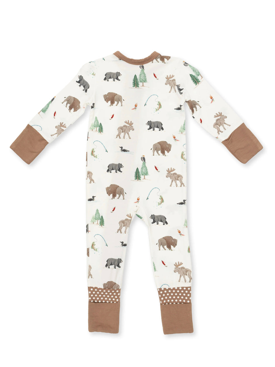 Kids' brown and white footed pajamas with animal and nature print, featuring bears, moose, and trees.