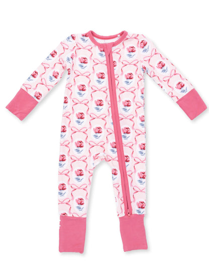 Pink floral baby onesie with long sleeves and a front zipper, featuring rose patterns and pink cuffs.