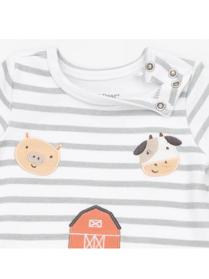 Striped baby onesie with animal patches: pig, cow, and barn, featuring snap closures at the shoulder.