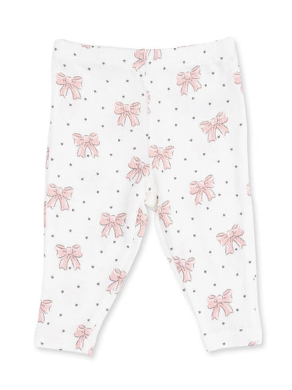 White leggings with pink bows and black dots pattern.