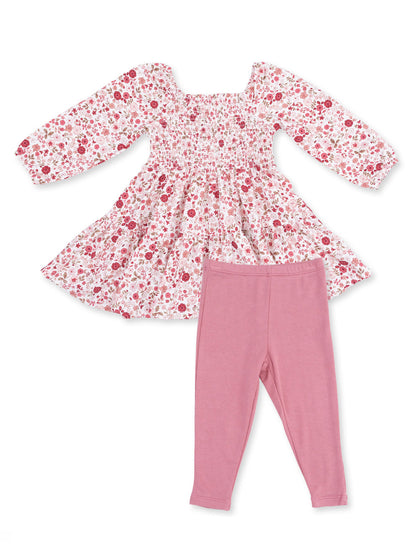 Floral smocked dress with long sleeves and pink leggings, perfect for casual wear.