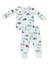 Kids' pajama set featuring playful winter-themed prints with snowplows, ski lifts, and snow-covered trees.