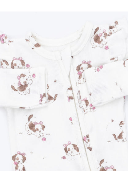White baby onesie with a playful dog print and pink accents, featuring long sleeves and a front zipper closure.
