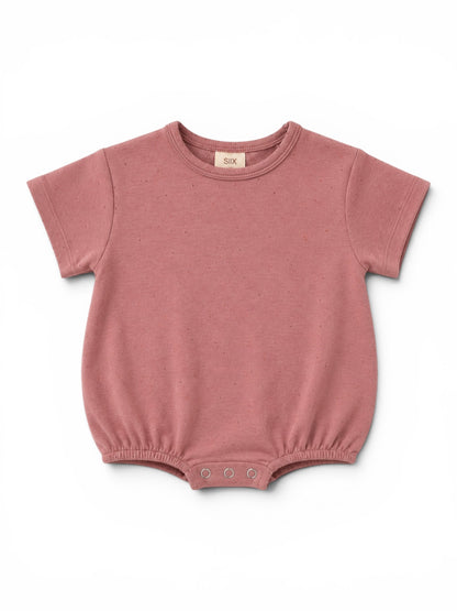Pink baby bodysuit with short sleeves and snap closure at the bottom displayed on a white background.