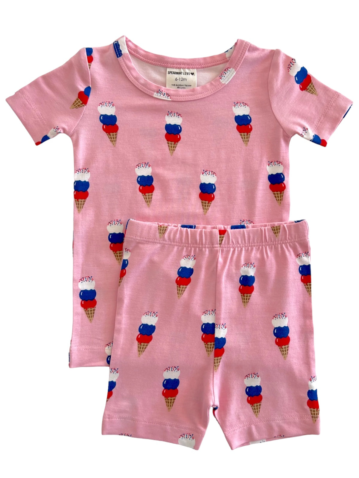 Light pink children's pajama set featuring colorful ice cream cone patterns. Ideal for ages 6-12 months.