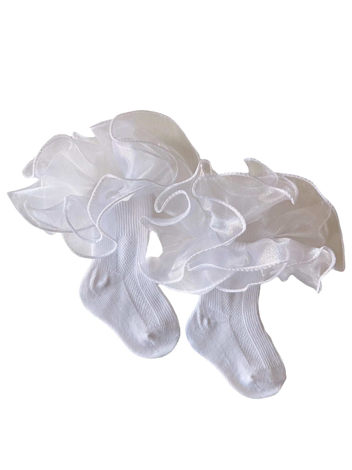 White frilly socks with sheer ruffles, perfect for formal occasions or baby outfits.