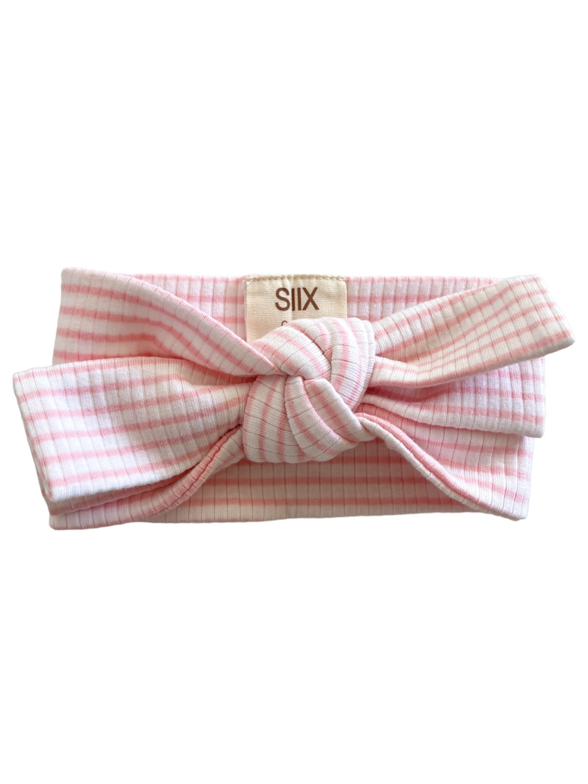 Pink striped headband with a knot at the front, showcasing soft fabric and a tag labeled "SIX."