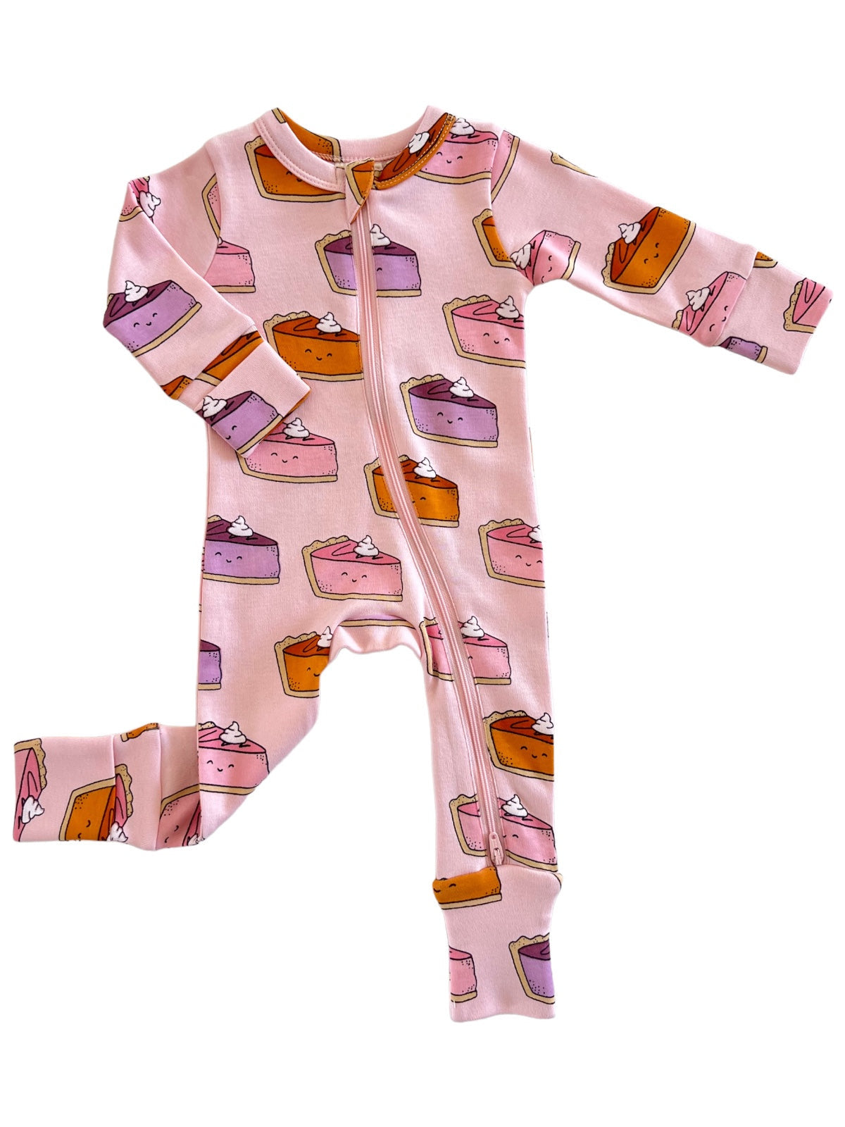 Pink pajama onesie with colorful pie illustrations and a front zipper, perfect for kids.