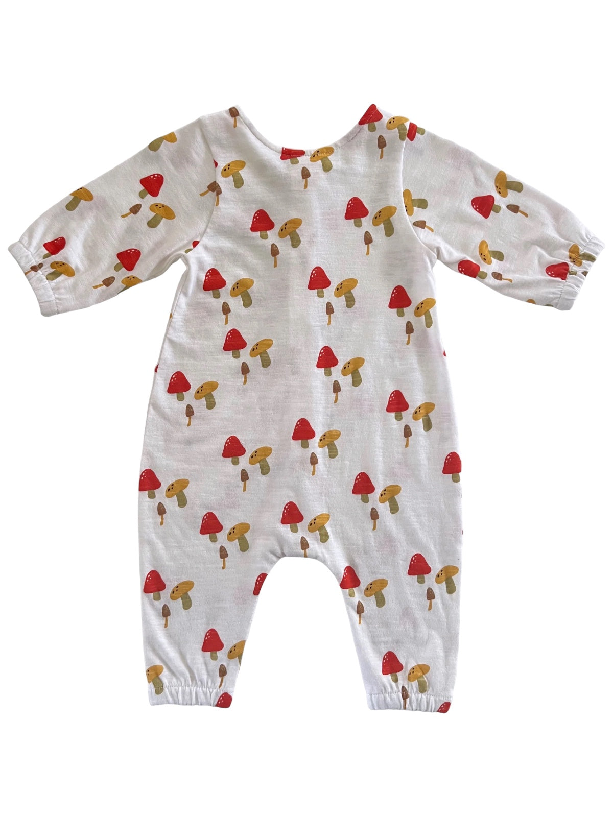 White baby onesie with colorful mushroom patterns, featuring long sleeves and a relaxed fit.